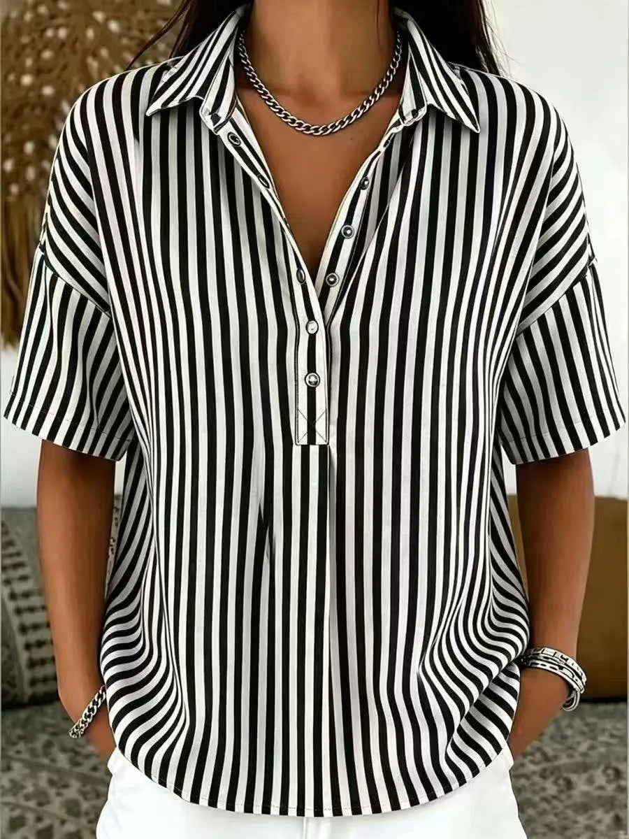 Front detail of striped collared blouse showing press-stud buttons and soft collar fold