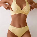 Close-up of pink pinstripe bikini bottom showing the fitted high-waisted cut and side seam gathering