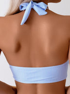 Close-up side view of blue pinstripe high-waisted bikini bottom showing ruched side seam detail