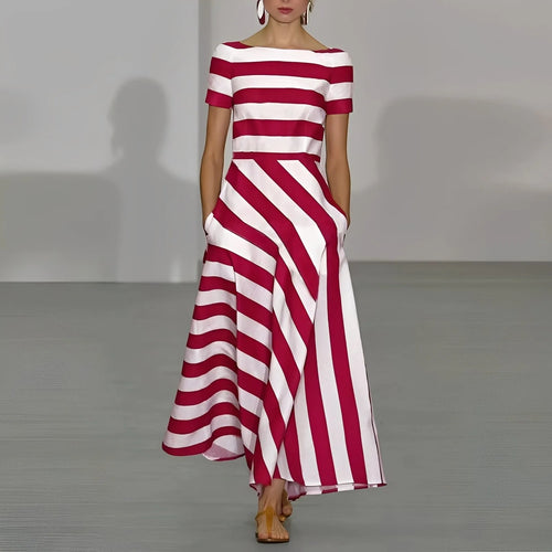 Model walks a runway in a red and white striped maxi dress with boat neckline, short sleeves and fitted bodice