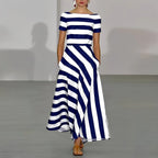 Front view of a navy and white striped maxi dress showing the diagonal skirt panel and A-line silhouette