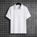 White textured knit polo shirt displayed on a hanger against a dark wire grid background, showing full front silhouette
