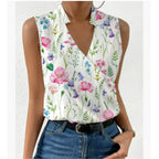 Sleeveless top in a multicoloured wildflower and fern print with a notched V-neck, styled with jeans and a belt