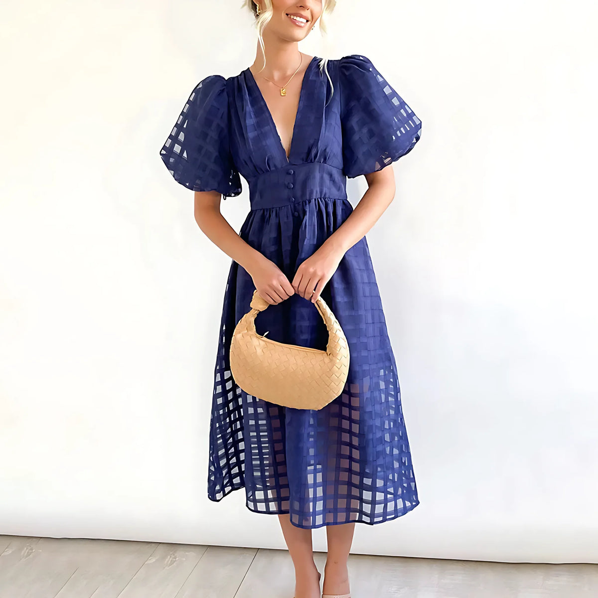 Navy blue sheer windowpane-check midi dress with voluminous puff sleeves and a fitted button-front waist.