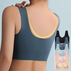 Back view showing wide supportive straps and racerback-style seamless back design in dusty blue, with colour swatches