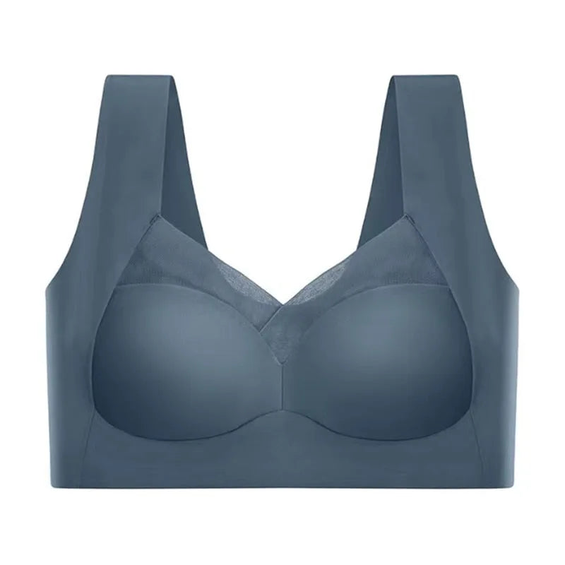 Flat front view of the dusty blue bra showing smooth moulded cups and sheer mesh V-panel