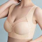 Close-up side view in nude beige showing smooth seamless side panel and cup shaping with slimming arrows
