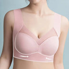 Close-up front view of the blush pink bra showing V-neckline mesh panel and side smoothing design