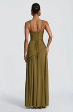 Back view of the olive green maxi dress with lace-up back detail and gathered asymmetric skirt panel