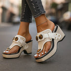 Black wedge sandal with tortoiseshell button detail paired with ripped grey denim and heart anklet