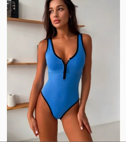 Blue one-piece swimsuit with black contrast trim, front zip closure and square neckline, close front view